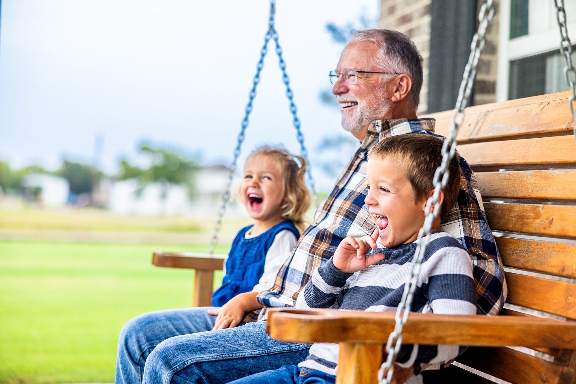 Diversification-Insight-4 two young children sitting with an older man on a porch swing